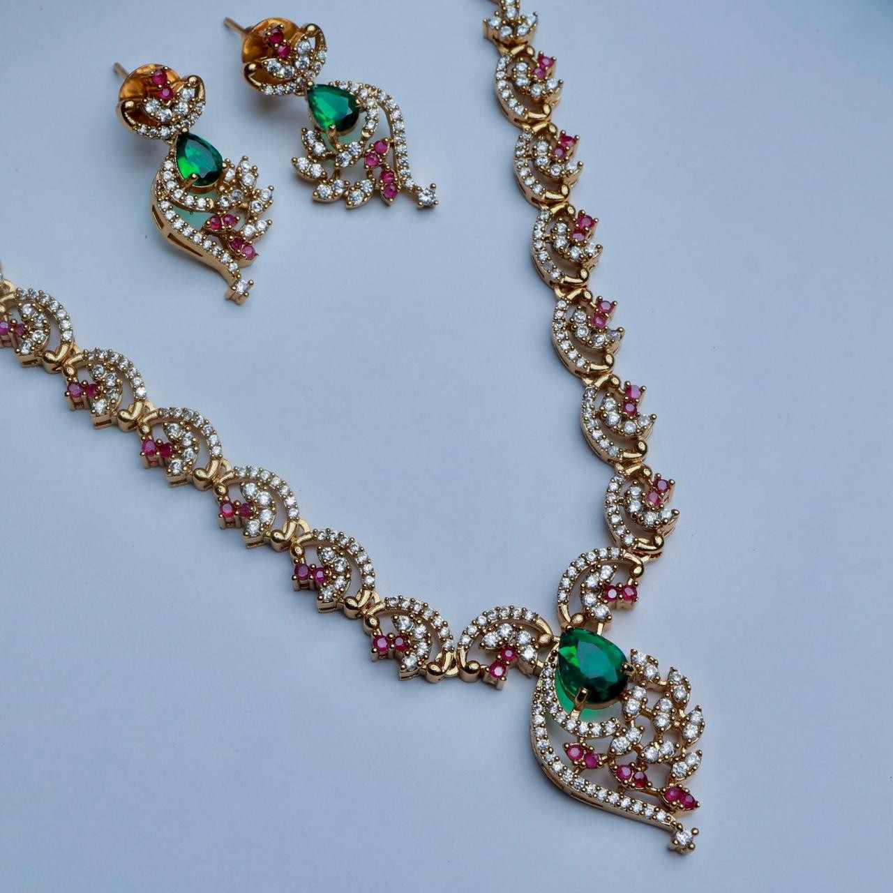 Premium Quality AD White Stone Floral Pattern necklace designed with Ruby red And emerald green Color stones Stone comes with Matching earrings N0148-CJ48