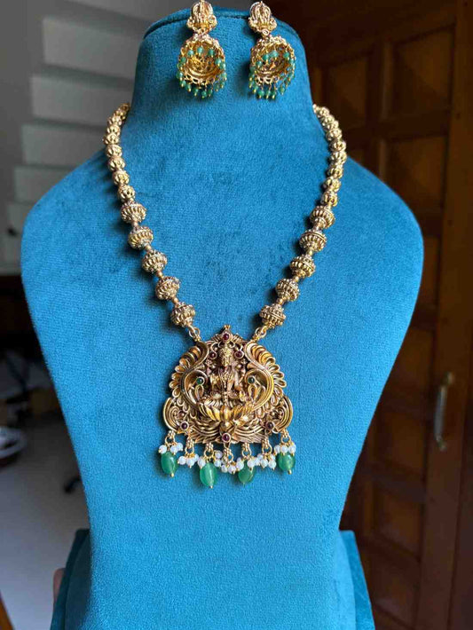 Middle Length Chettinad Haram Matte Finish Lakshmi Pendent with Green Beads H0036-CJ49